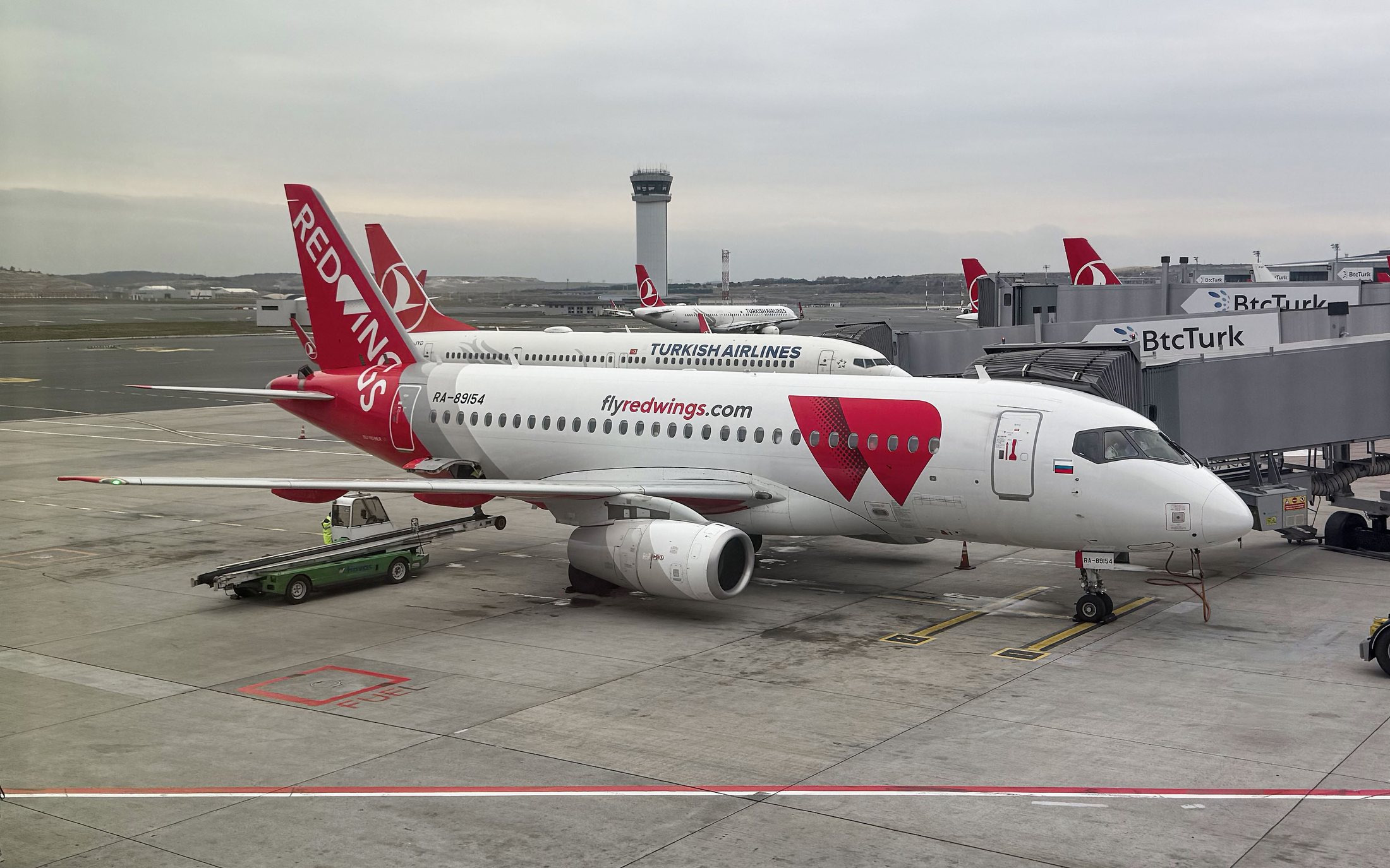 A Red Wings Sukhoi Superjet on stand at Istanbul Airport